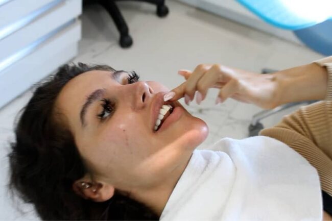 dental patient looking her new smile