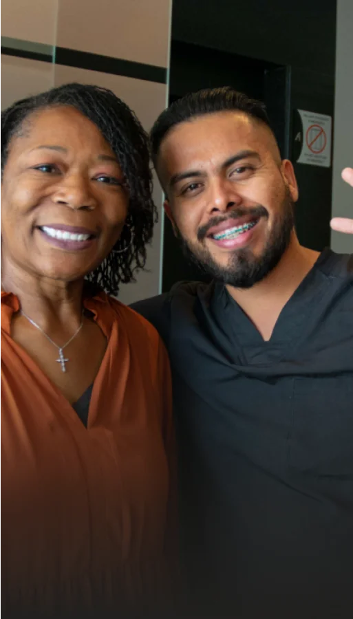 Dr. Genaro Maya, specialized implant dentist with patient