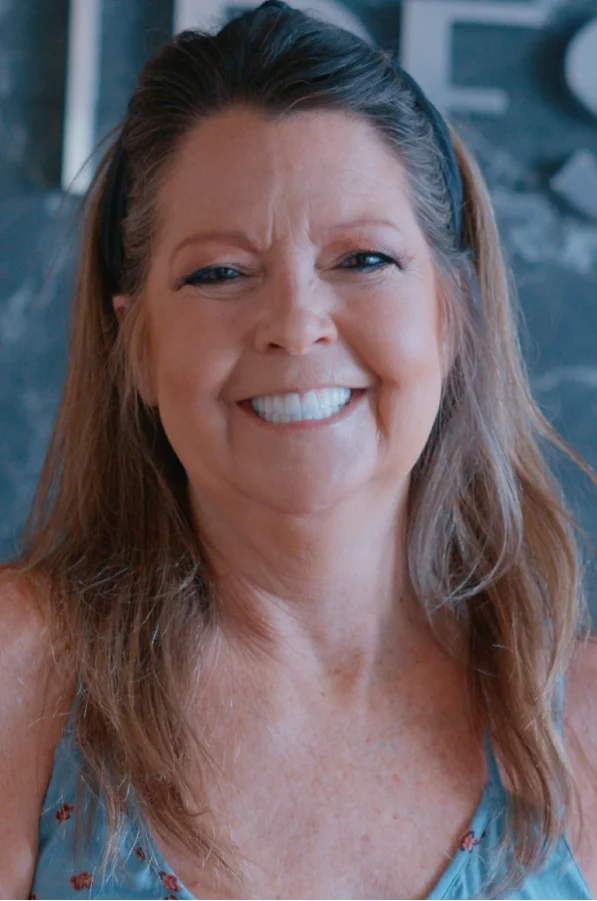 erderly woman smiling again with confidence after full mouth restoration