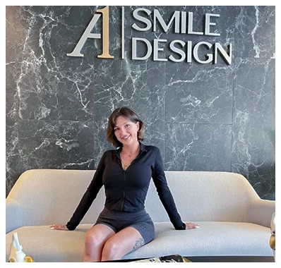 happy patient showing-off her new smile design procedure at A1 lobby