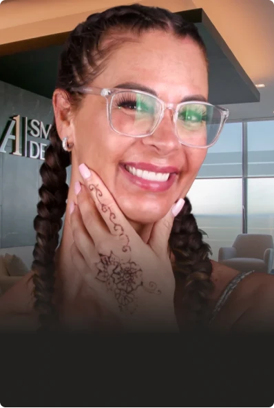 after shot of a young woman who transformed her smile with porcelain veneers.