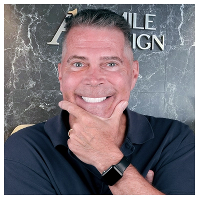 A patient revealing a bright, new smile at A1 Smile Design lobby