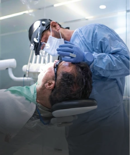 dentist performing dental implants procedure at A1 Smile Design