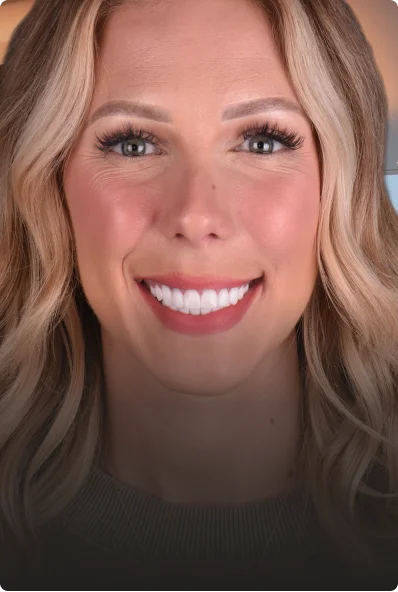 young blonde woman showing teeth after veneers done