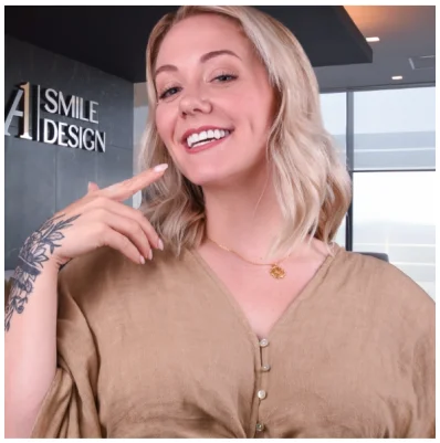 A beaming patient at A1 Smile Design, showing off their new smile post-treatment