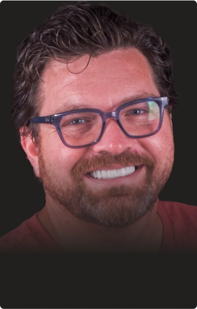 A photo of a satisfied patient smiling after their dental crown procedure.