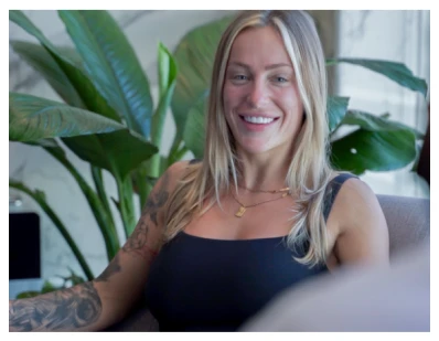  A patient smiling happily after their dental crown procedure.