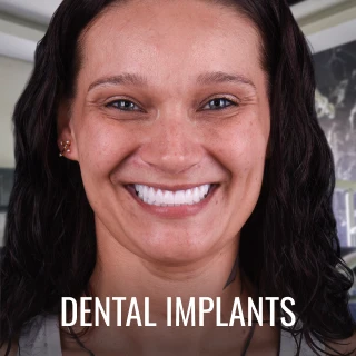 smiling patient after dental implants treatment at A1 Smile Design