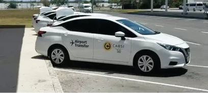 White CABSI transportation vehicle parked outdoors.