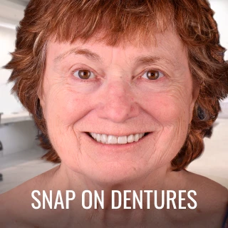patient showing results after snap on dentures treatment