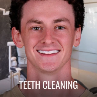 patient smiling after professional teeth cleaning service