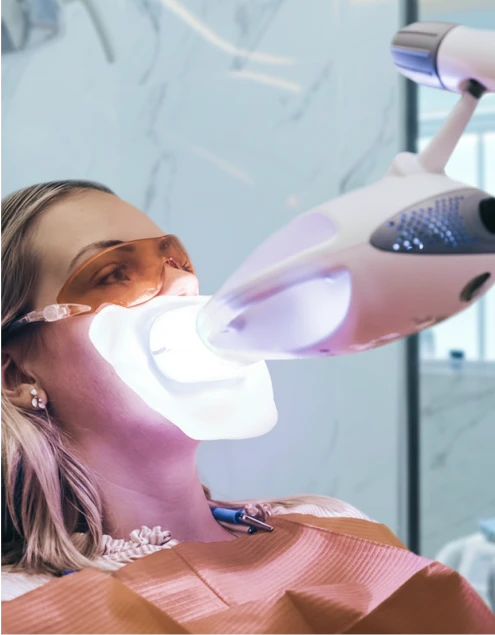 Zoom teeth whitening treatment at professional dental clinic in Playa del Carmen.